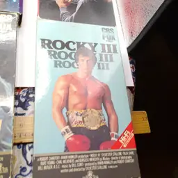 This lot of 9 VHS included The Breakfast Club, E.T., Scarface, Jurassic Park, Spaceballs, WarGames, and Rocky 3,4,5