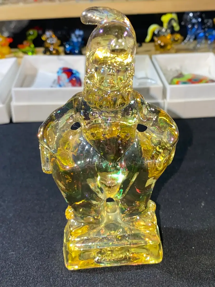 #06- Mosser Glass Co. This is part of the Series -  SO GLAD I FOUND YOU AT THE END OF THE RAINBOW - MINDY.  The Jester Style Clown is 4.75" Tall. He is a clear Yellow color.