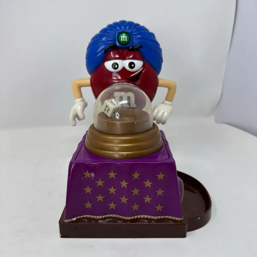 Vintage M&M's Red Fortune Teller candy dispenser features "The Great Red-ini"