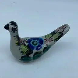 #3048 Hand-painted Tonalá pottery bird figurine with floral motifs.