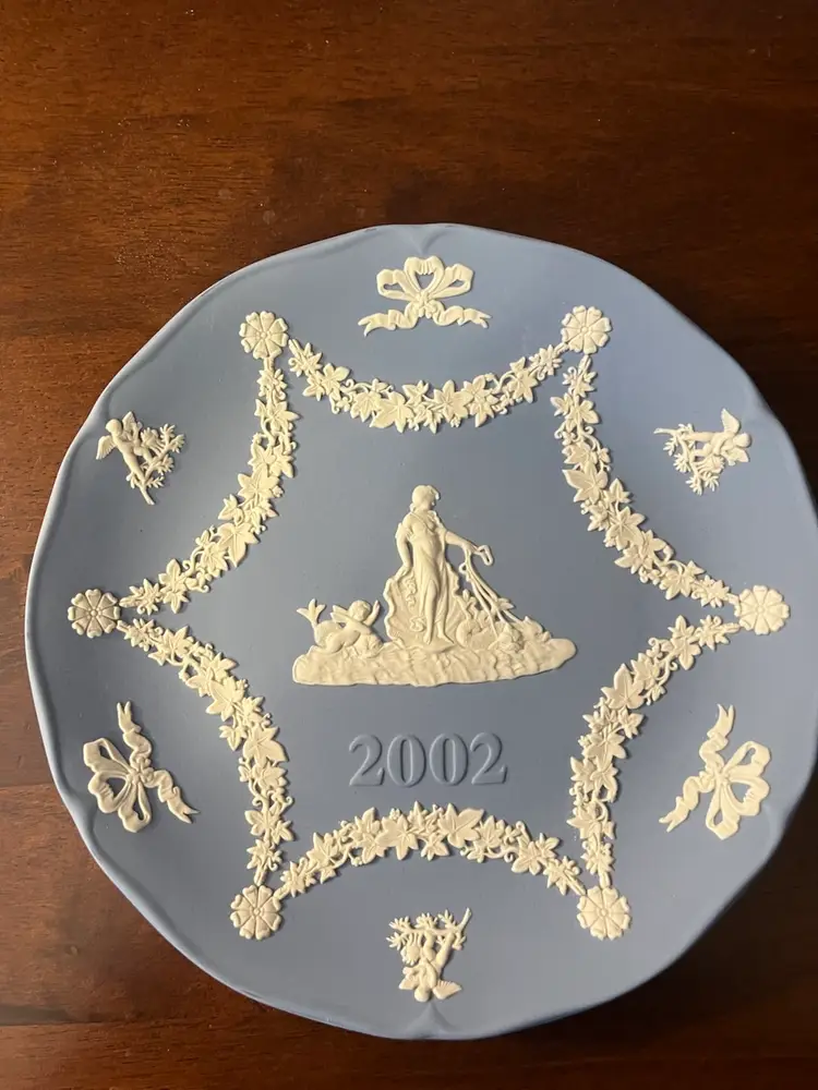 A blue Wedgwood Jasperware collector plate from 2002.  7” In Box