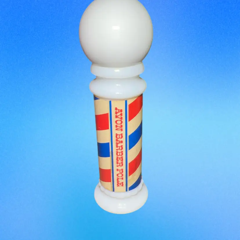 This is a vintage Avon Barber Pole collectible bottle. 1980s Empty Milk glass