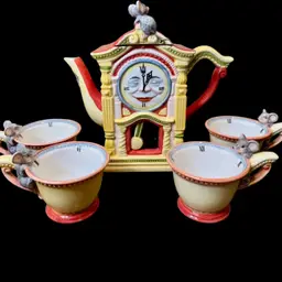 Vintage Department 56 Storybook "Hickory Dickory Dock" Clock Tea Set. It is a retired collectible from the 1996 Storybook collection.