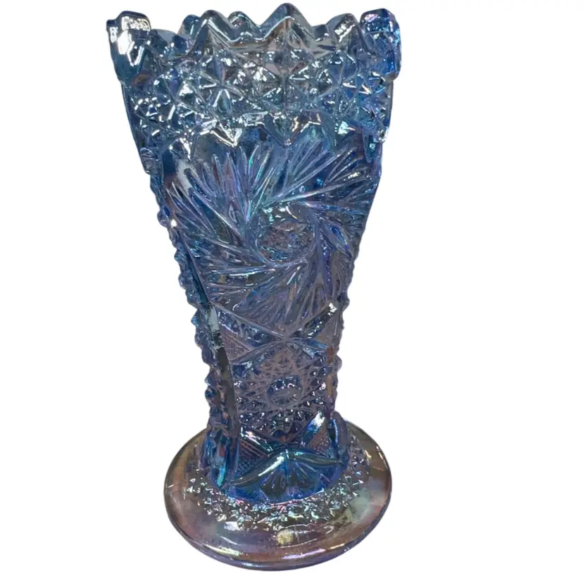 This is a blue iridescent carnival glass vase by L.E. Smith. 6”