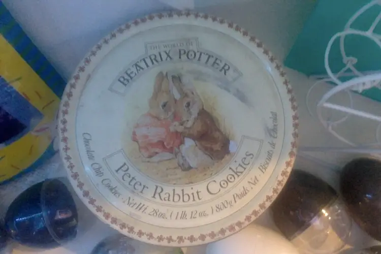 Vintage Beatrix Potter Cookie Tin, Easter Flag, Easter Egg Carousel, and Leggs Eggs.