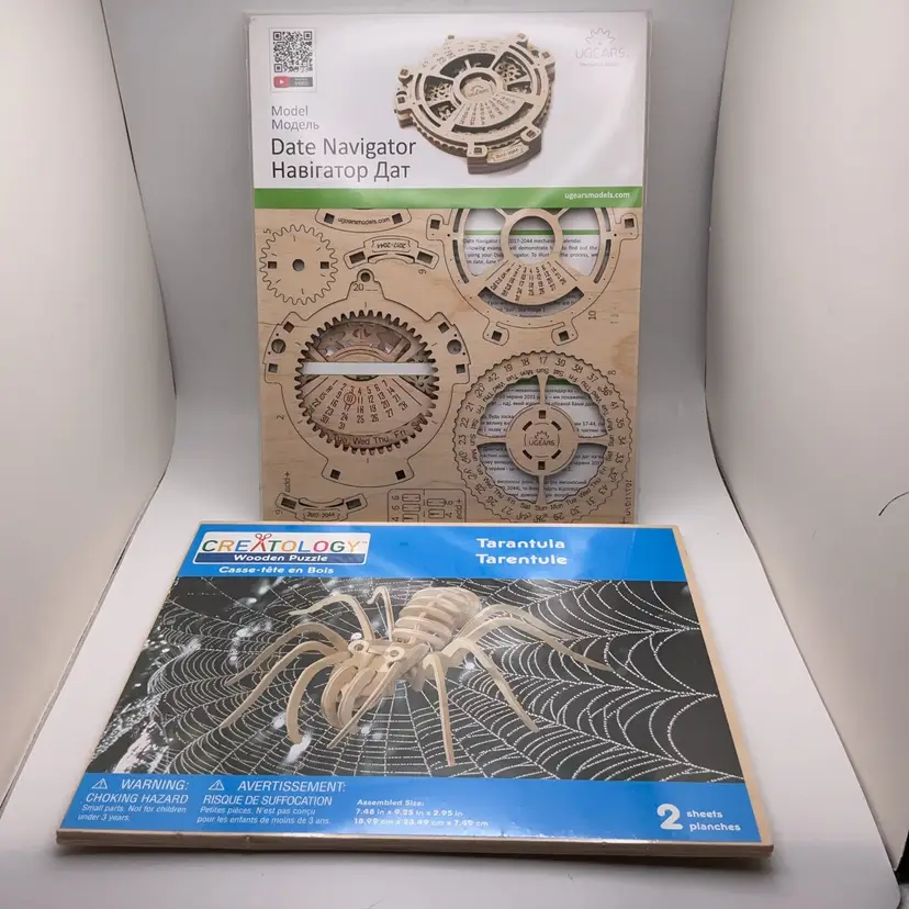 POW4 NIB Two 3D Wooden Puzzles Spider & Date Navigator 10 x 6"