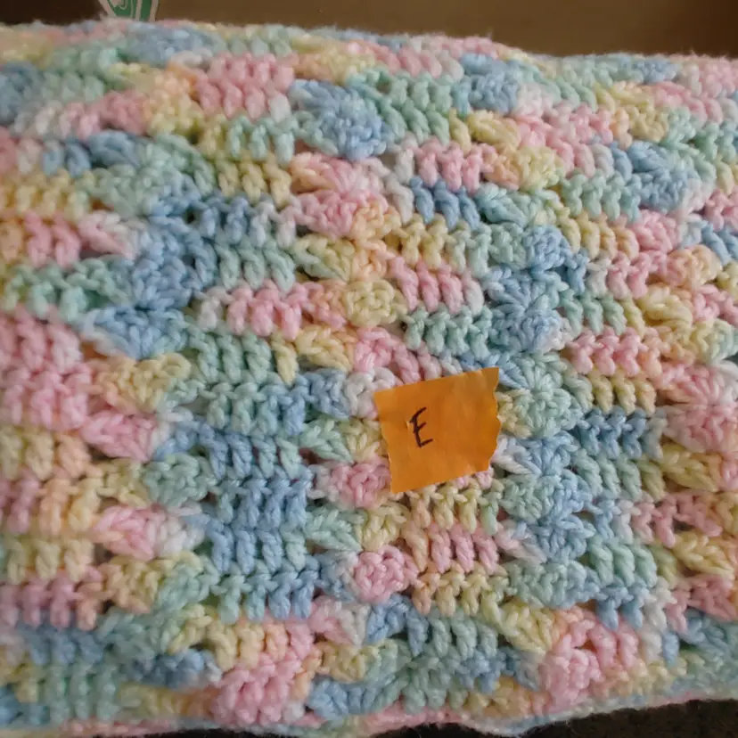 Afghan E- approx size 43 x 53. Blue, yellow, pink & green zig zag stripes. As shown.