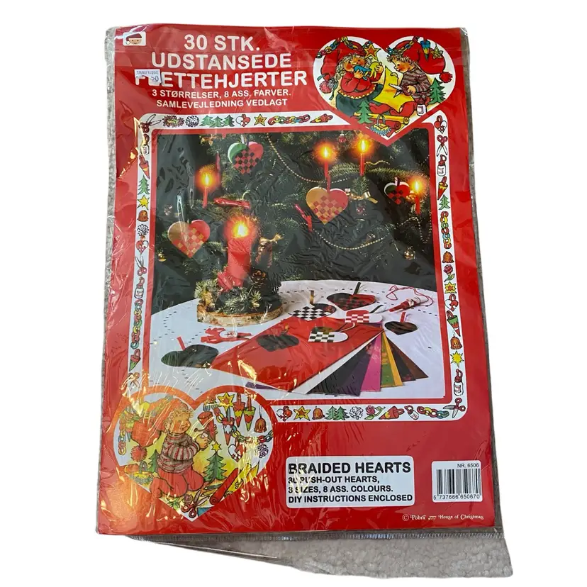 This is a Pobra Heart Basket Paper Kit (No. 6506), which provides pre-cut sheets to make traditional Danish woven hearts (julehjerter). 
The kit includes 30 push-out hearts in 3 sizes and 8 assorted colors.
Danish woven hearts are a traditional Christmas ornament, also popular for Valentine's Day