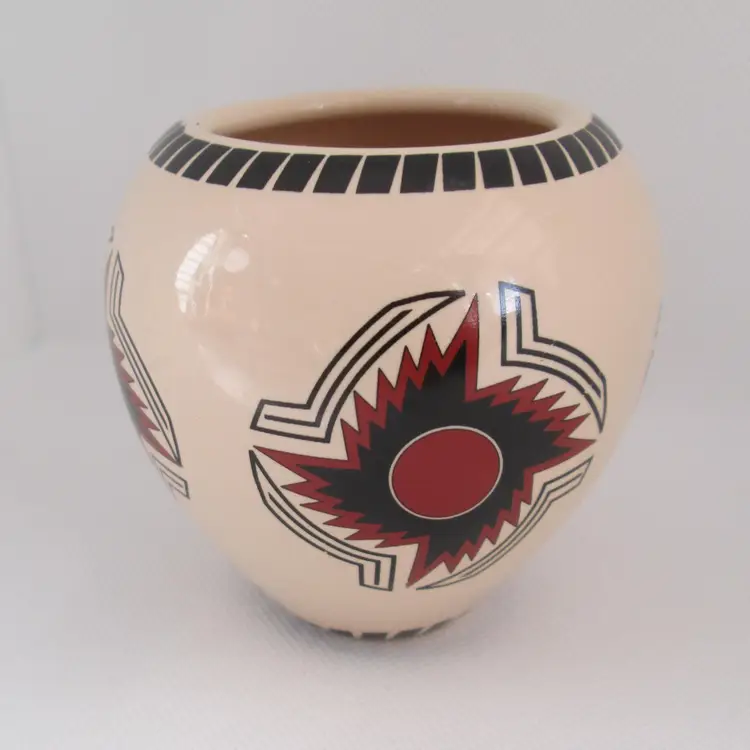 Vintage artisan ceramic pot with Aztec design from central Mexico area