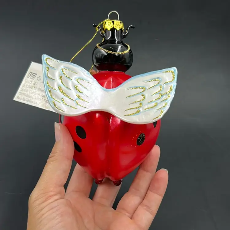 Vintage Handcrafted By Figi Lady Bug Holding A Sun Flower Blown Glass Ornament With Wings.  6” T Had Tags And Original Tag 2002