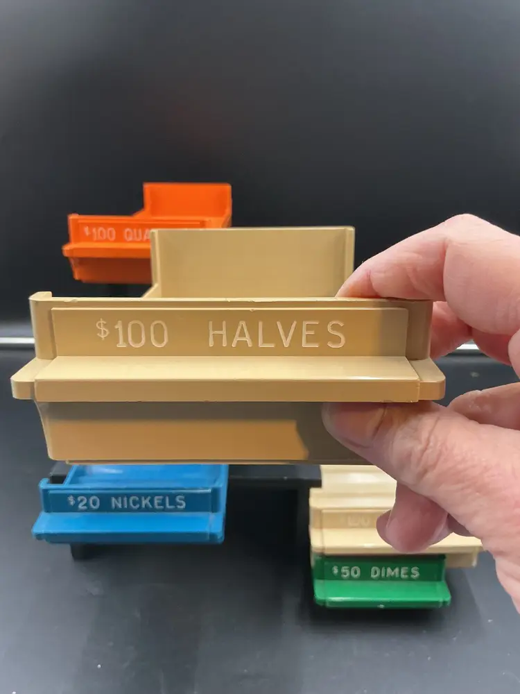 Plastic coin trays. Bright colors. Great for your jewelry display or coin collection.