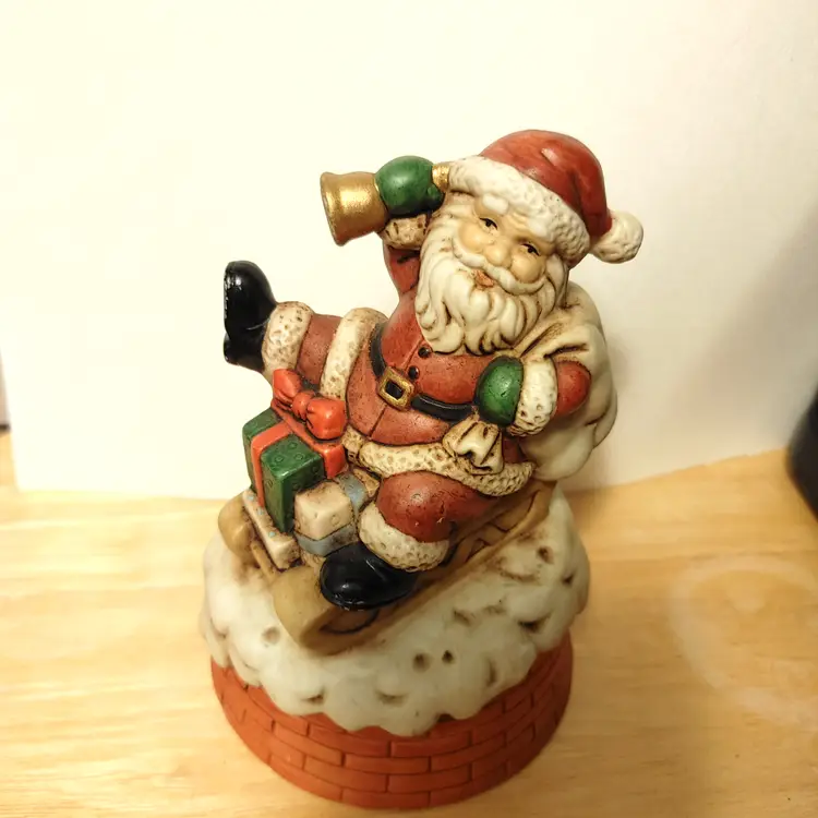 Santa on sled with bell. Music box.