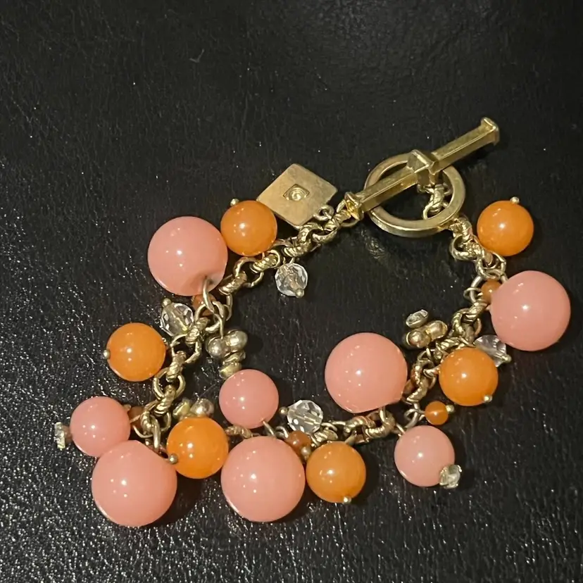 20. Liz Claiborne, pink and coral acrylic bead on gold toe bracelet.