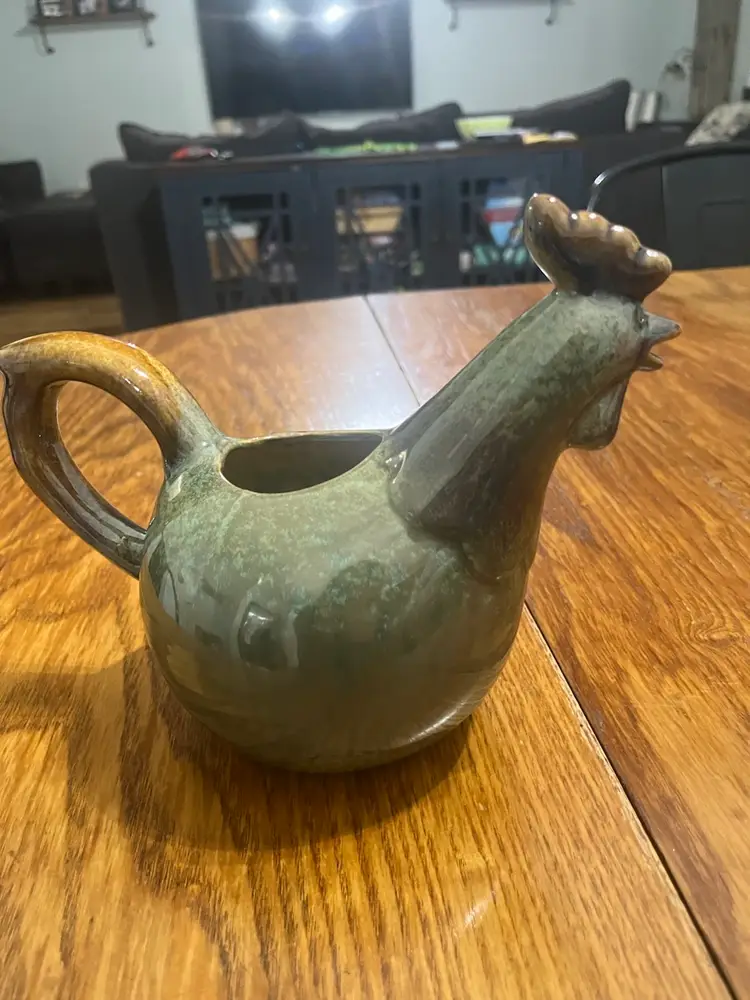 Handmade ceramic rooster-shaped pitcher / Watering Can with green speckled glaze.
7” Tall