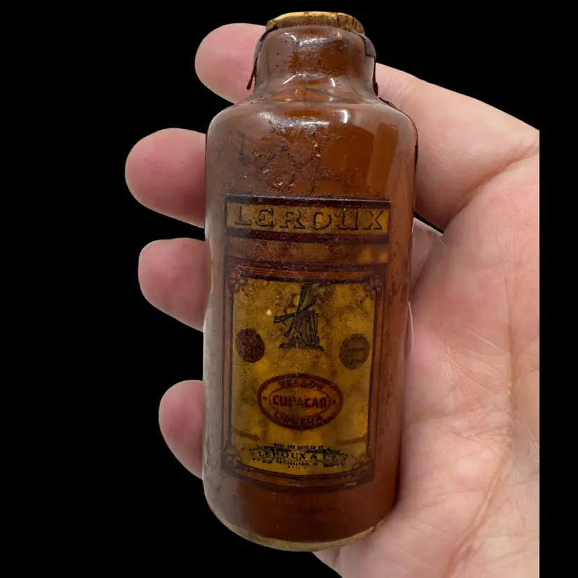 Vintage Leroux Curacao Liqueur stoneware miniature bottle.