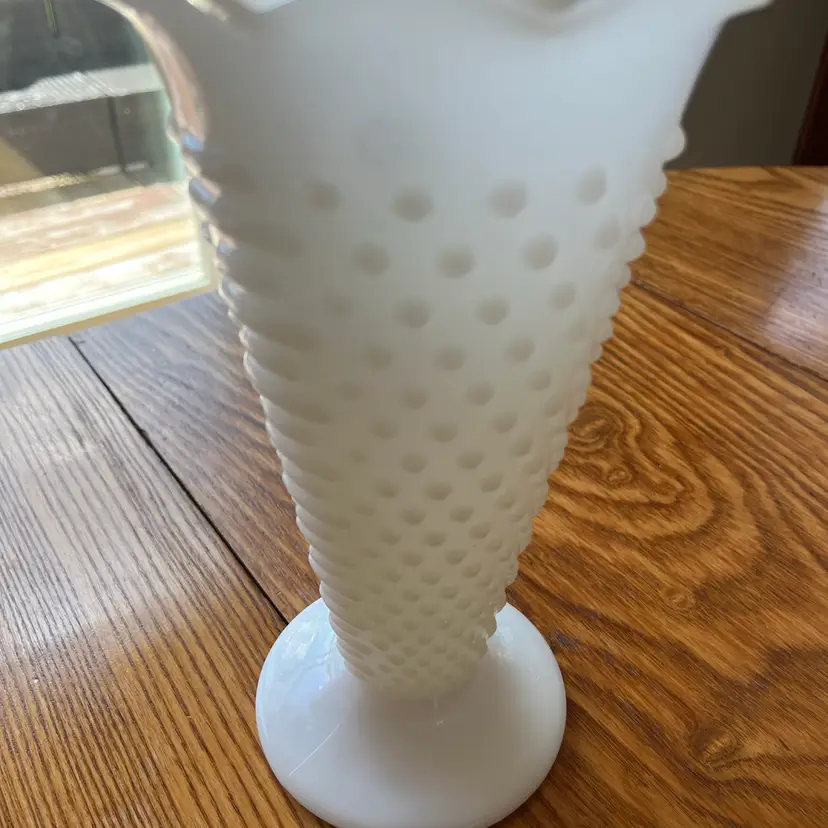 9.5” Vintage Fenton hobnail milk glass vase with a ruffled rim.