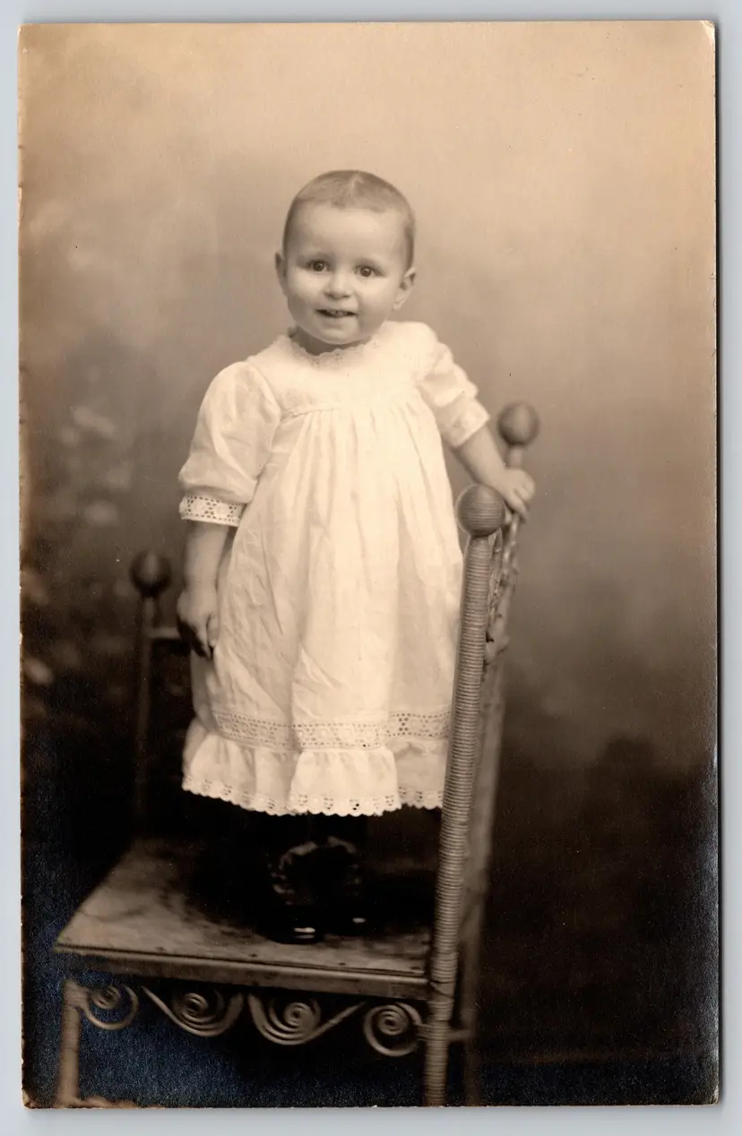 Postcard RPPC Happy Child Standing on Chair Real Photo White Gown -  9311