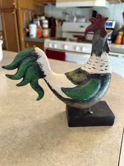 Vintage Hand-carved and painted wooden rooster figurine on stand.