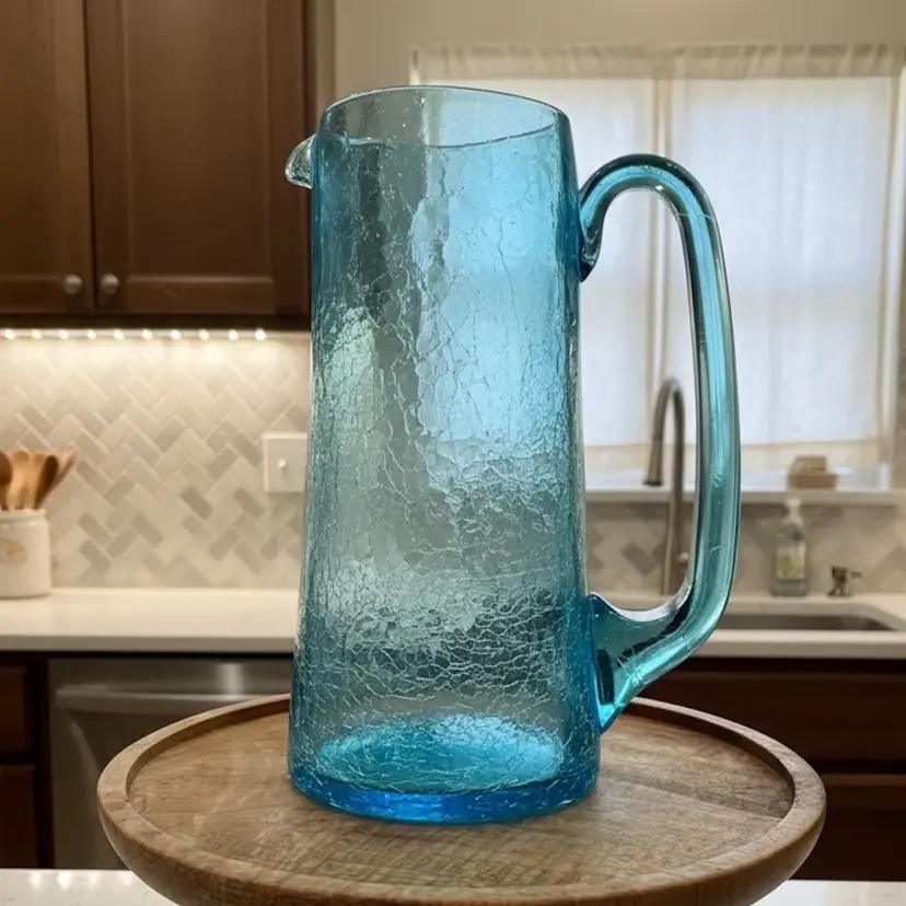 #05 7.5” T 4” W, Vintage Blenko blue crackle glass pitcher, model 7018 or similar from the mid-20th century