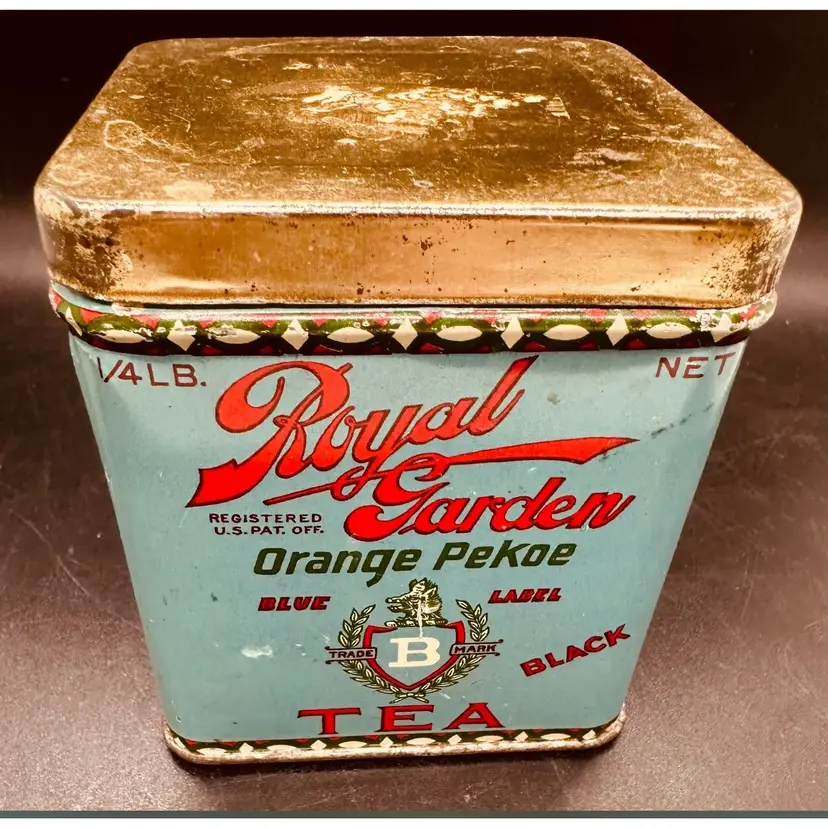 111. Antique Royal Garden Orange Pekoe Tea tin.