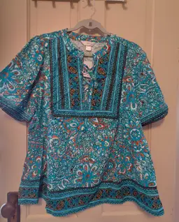 Top- Brand: CJ Bank. Teal flower top. Size 2X. NWT. Retail $59.95. Material- 100% cotton. No callouts.