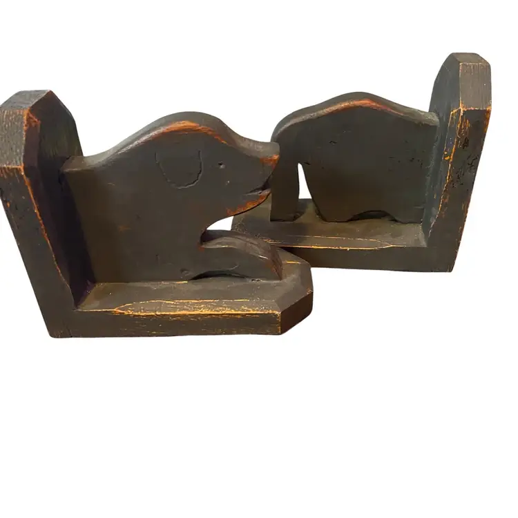 This item is a set of vintage hand-carved wooden bookends Dog