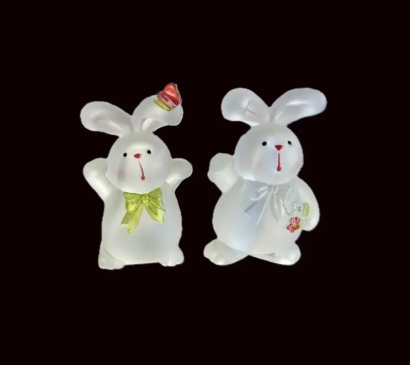 Pair of delightful heavy molded plastic figurines of rabbits/bunnies