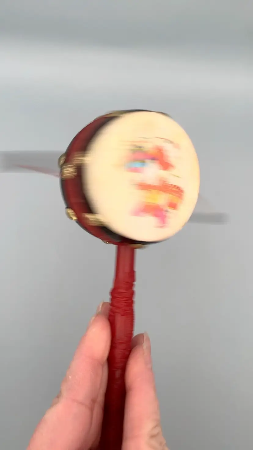 Chinese traditional rattle drum, monkey drum or pellet drum.