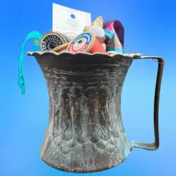 #184A Beautiful Vintage Hammered Copper Mug Etched Tin Cup Filled With Vintage Sewing Notions. Spools Of Thread, Lace Remnant, A Thimble, Pack Of Needles, And A Pattern Tracing Tool