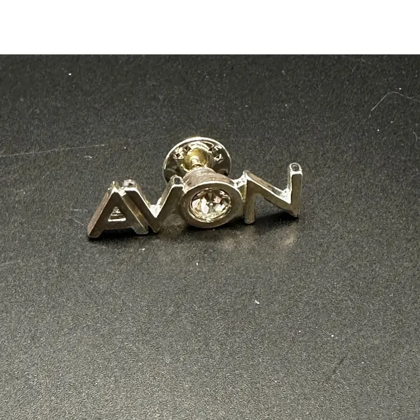 A114 - Avon Rhinestone Logo Pin