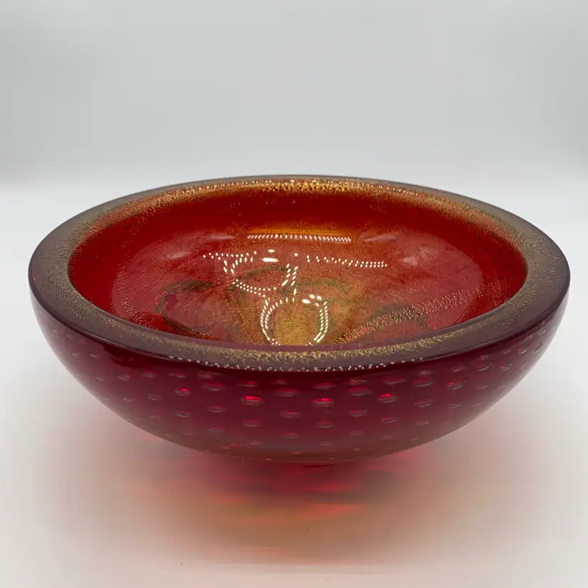 #1007 A ruby red Murano glass bowl with controlled bubbles and gold flecks.