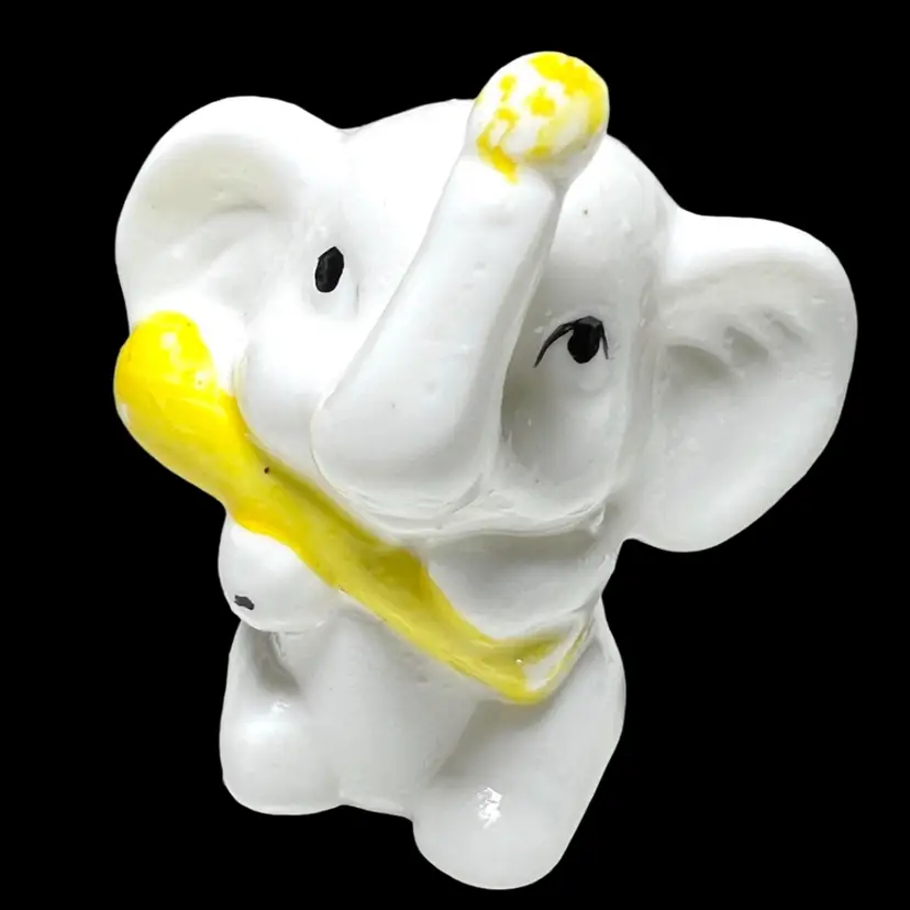 Petite Porcelain White Elephant Figurine. Trunk Up. Holding A Yellow Ear Of Corn? Super Cute!