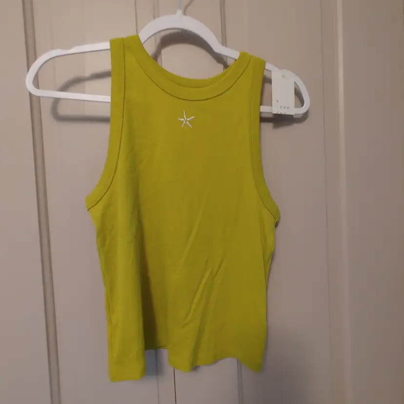 Top- Brand: A New Day. Size Large. NWT. Green tank top. Material- 97% cotton, 3% spandex.  No callouts.