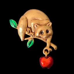 Danecraft Gold Tone Raccoon with Green Leaves and Dangling Red Apple Brooch