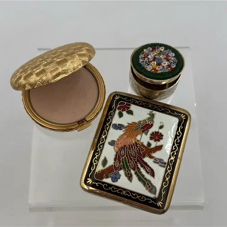 A set of three vintage cloisonne a peacock brass mirror, micro mosaic pill box Revlon love Pat press powder, compact