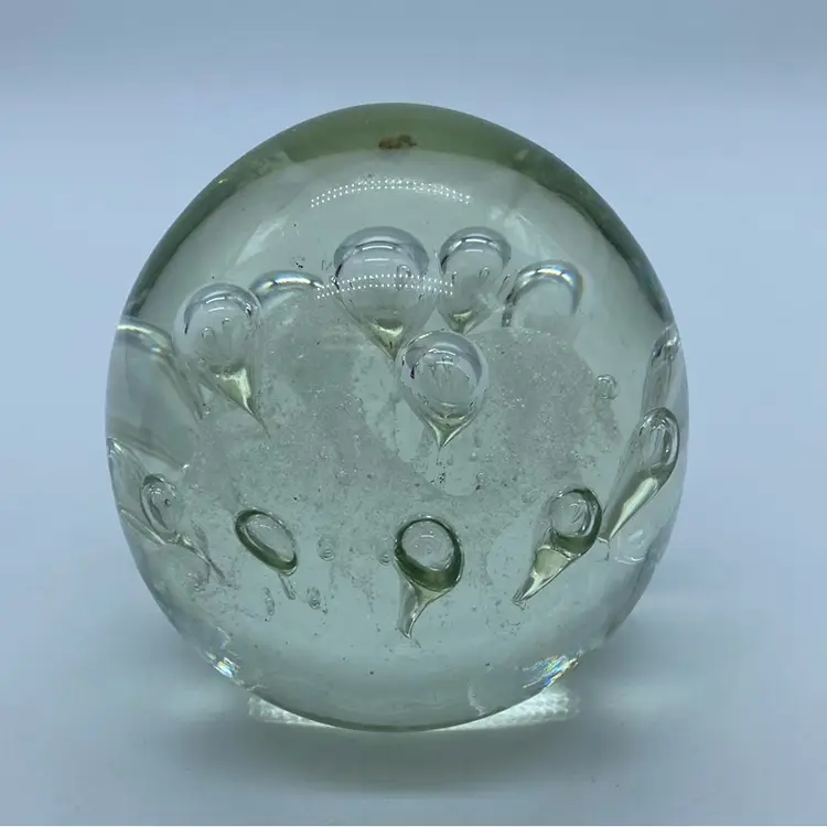 #0052 Vintage clear glass paperweight with controlled air bubbles.