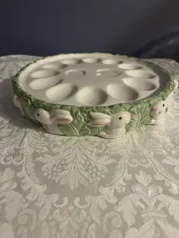 Ceramic Easter deviled egg plate with bunnies and leafy trim. -10”