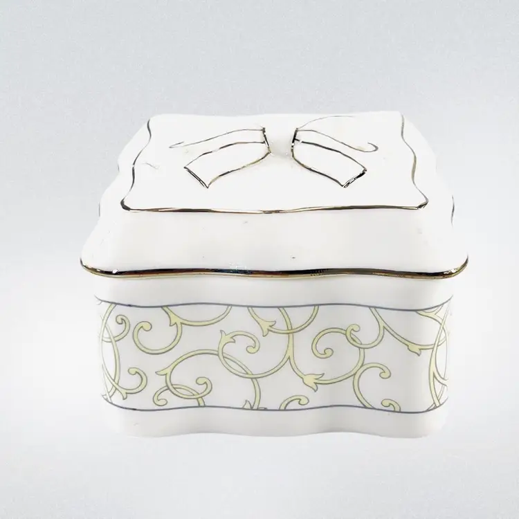 Wedgwood Trinket BoxCelestial Platinum PatternBone China Platinum Tone TrimApplied 3-D Bow on Lid Decorative Scroll Pattern On Sides