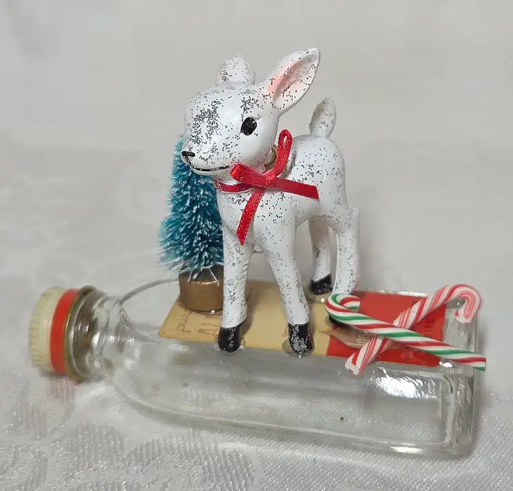 Cute handmade Christmas Decor w/Deer standing on vintage Almond Extract Bottle