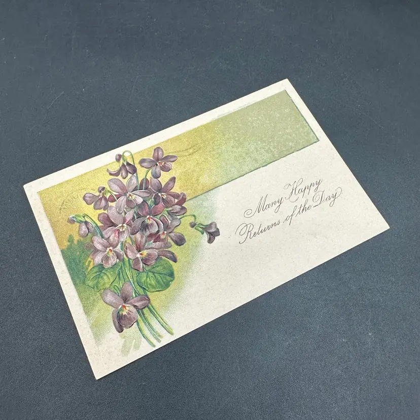 “Many Happy Returns” Violet Purple Floral Antique Postcard, American News Company Posted 1907