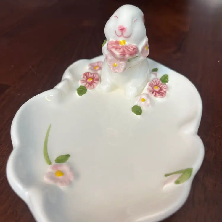 Vintage 1985 Avon ceramic bunny rabbit floral trinket dish. 5.5” Long Bunny 2.5” Tall 
Chip On Left Ear.