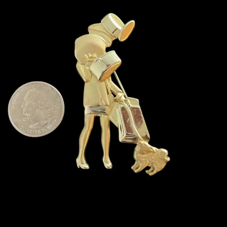 AJC Gold Tone Shopper Pin in Gold Tone With Packages and Dog
