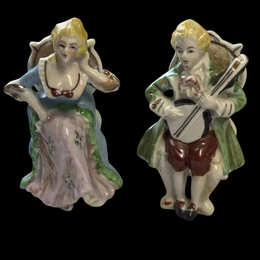Pair of hand-painted porcelain figurines from Occupied Japan.