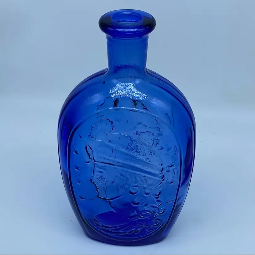 #0229 Cobalt blue glass bottle with embossed eagle and Lady Liberty 9” Tall