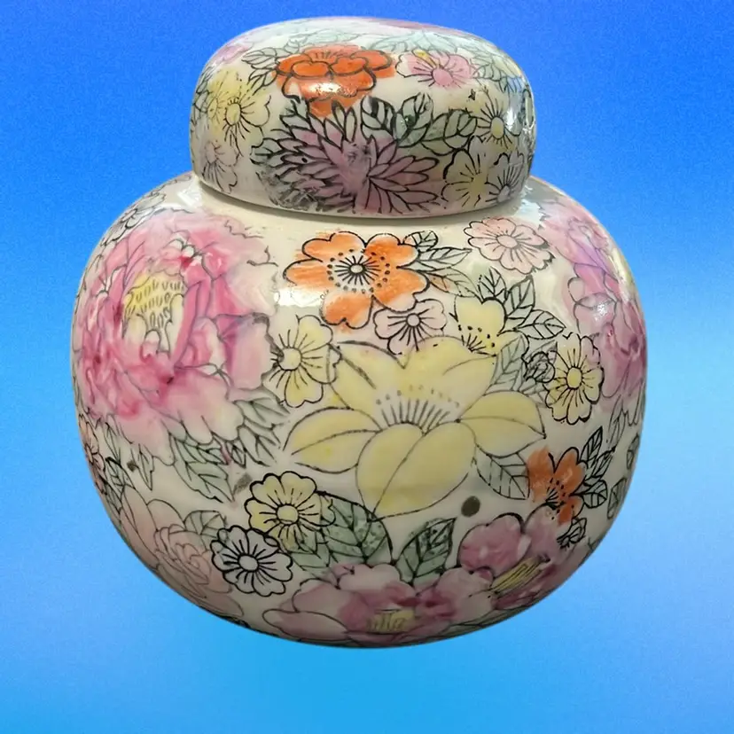 This is a vintage floral Design On Porcelain ginger jar 5” Tall 4.5”wide