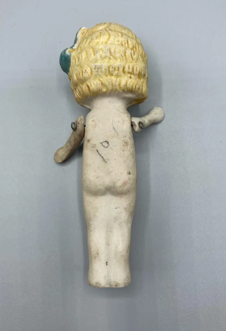 Made in Japan Bisque Doll with Blonde Hair and Blue Bow / Jointed Arms and Frozen Legs / Vintage