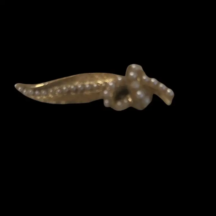 This item appears to be a vintage Crown Trifari Sweater or Hair Clip featuring faux pearls and a gold-tone setting, likely designed by Alfred Philippe in the 1950s.