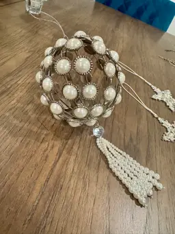 8” long 4” wide. Set of 5 silver metal christmas ornament ball with faux pearls and a crystal bead/pearl tassel