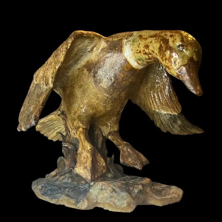 Duck In Flight Sculpture
