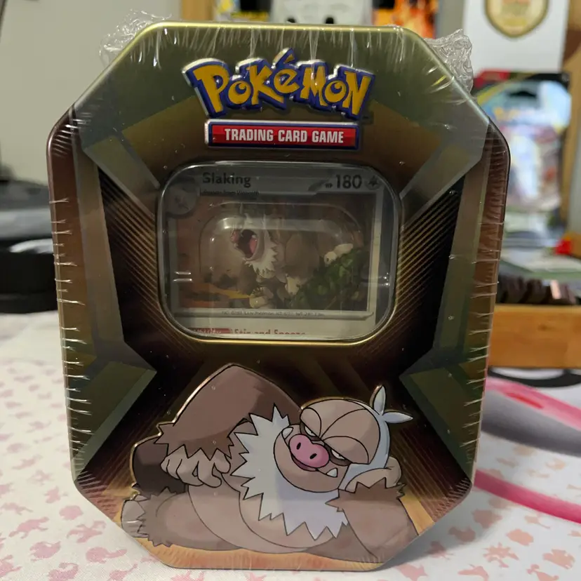Pokémon TCG Triple Whammy Collector Tin featuring the character Slaking.